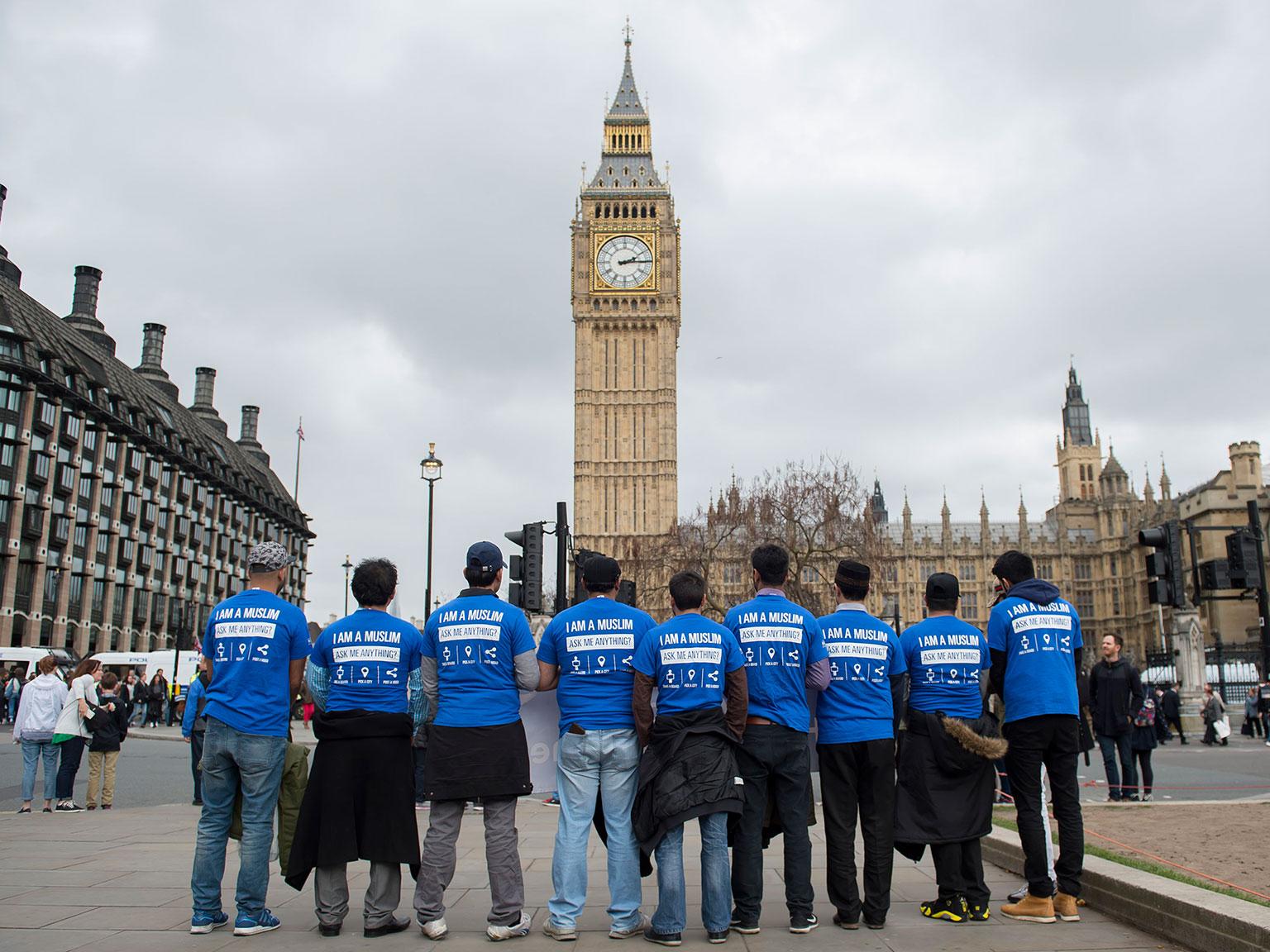 Ahmadiyya Muslims wearing 'I am a Muslim, ask me anything' T-shirts in London