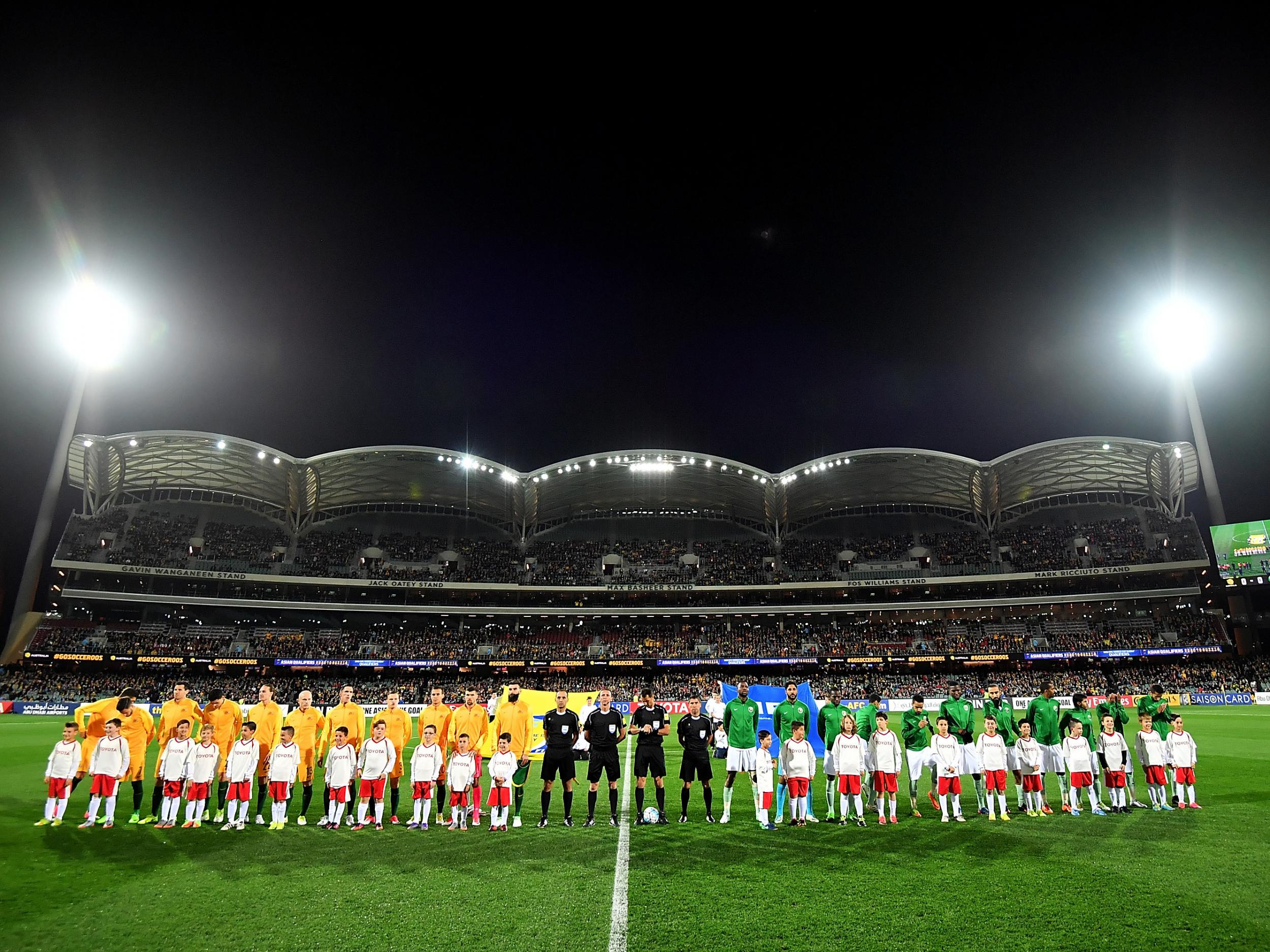 The two two teams line-up prior to kick-off for the national anthems