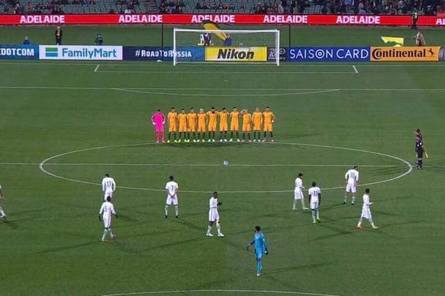 The Saudi players did not pause their warm-up to pay their respects