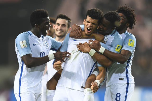 Dominic Solanke scored twice, either side of an Ademola Lookman goal, to seal England's place
