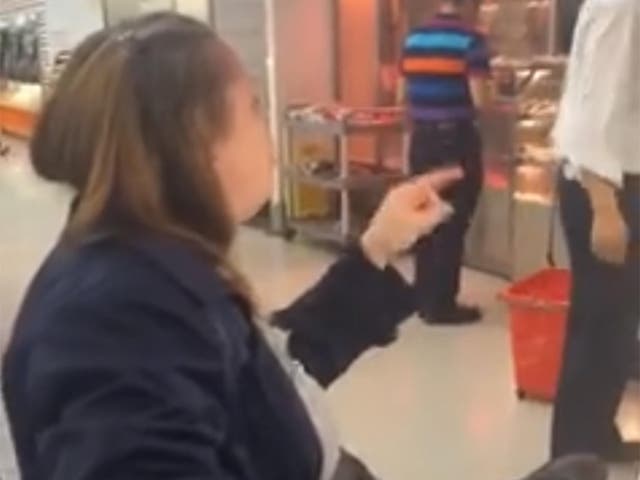 The woman is seen in the video berating members of staff