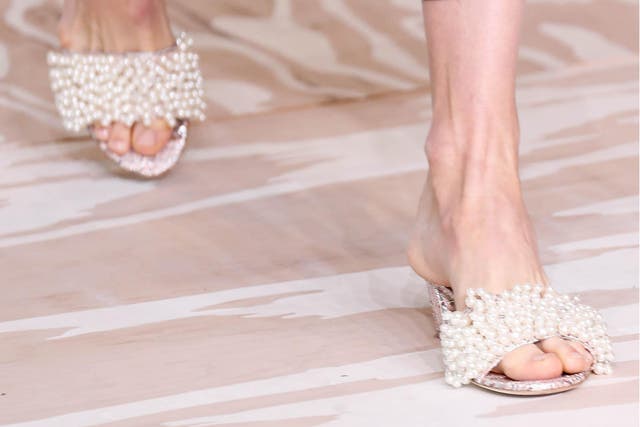 Tory Burch’s slides came covered in clusters of girlish pearls