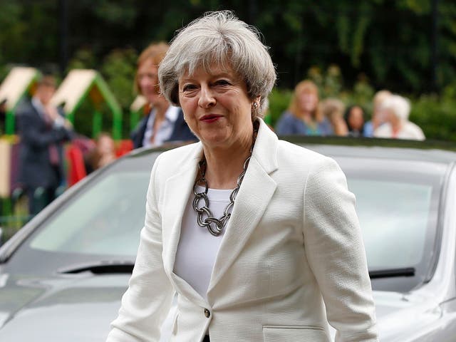 Britain's Prime Minister Theresa May arrives to vote in the general election at polling station in Maidenhead, England