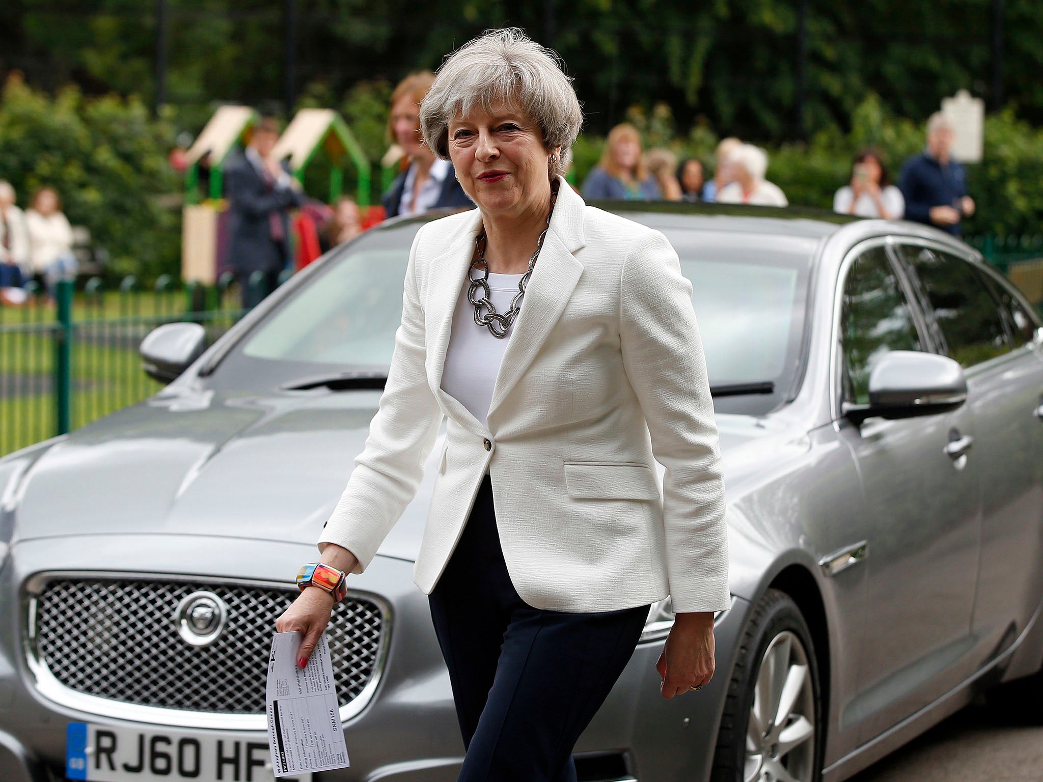 Theresa May arrives to cast her ballot at a polling station in Maidenhead, England