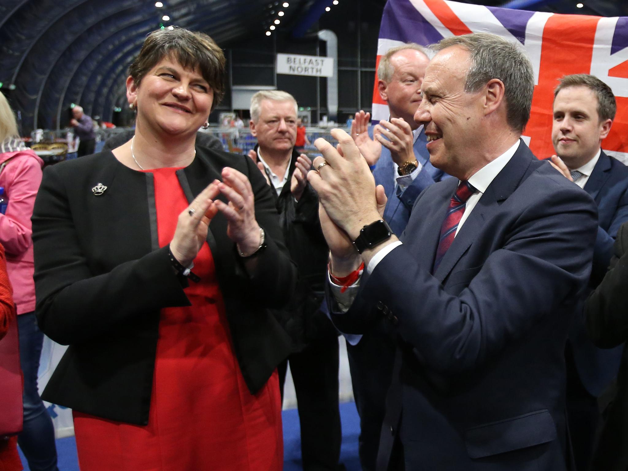 DUP leader Arlene Foster and deputy leader Nigel Dodds cheer as Emma Little Pengelly is elected to the South Belfast constituency at the Titanic exhibition centre in Belfast