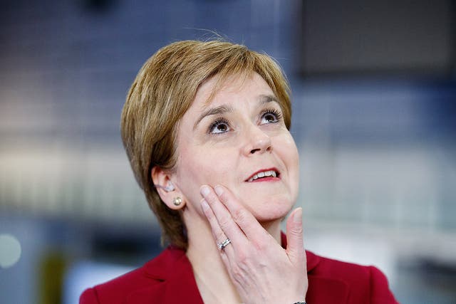 Scottish National Party (SNP) leader Nicola Sturgeon looks up at the Emirates Arena in Glasgow, Scotland