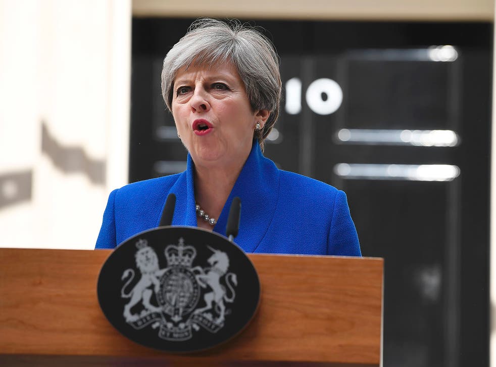 Britain's Prime Minister and leader of the Conservative Party Theresa May delivers a statement outside 10 Downing Street in central London