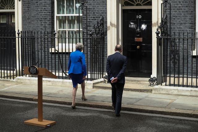 Theresa May enters 10 Downing Street with husband Philip after speaking on 9 June