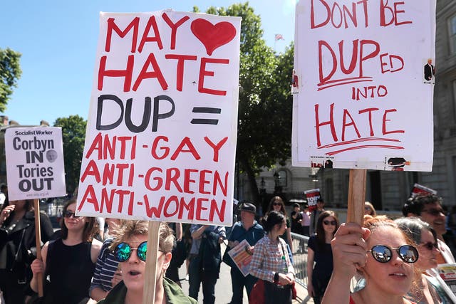 People in London are demonstrating against an agreement with the DUP