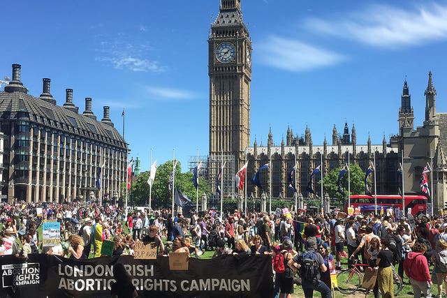 Protesters gather in Westminster, central London to voice their anger at Theresa May's government and her alliance with the Democratic Unionist Party