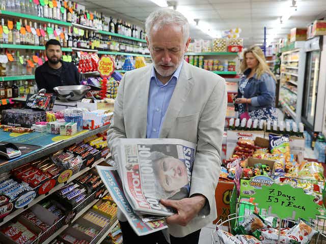 Labour Jeremy Corbyn looks at newspapers following the general election