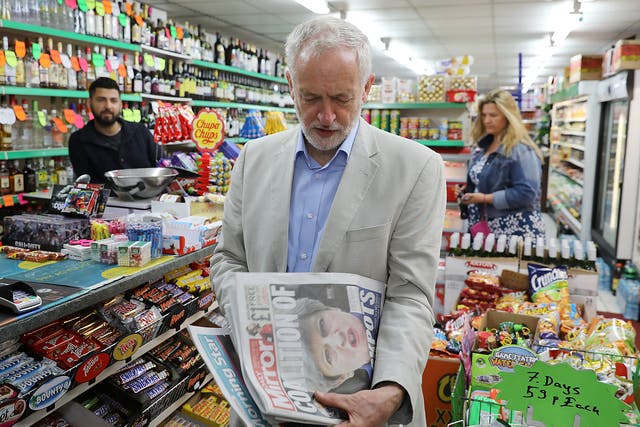 Labour Jeremy Corbyn looks at newspapers following the general election