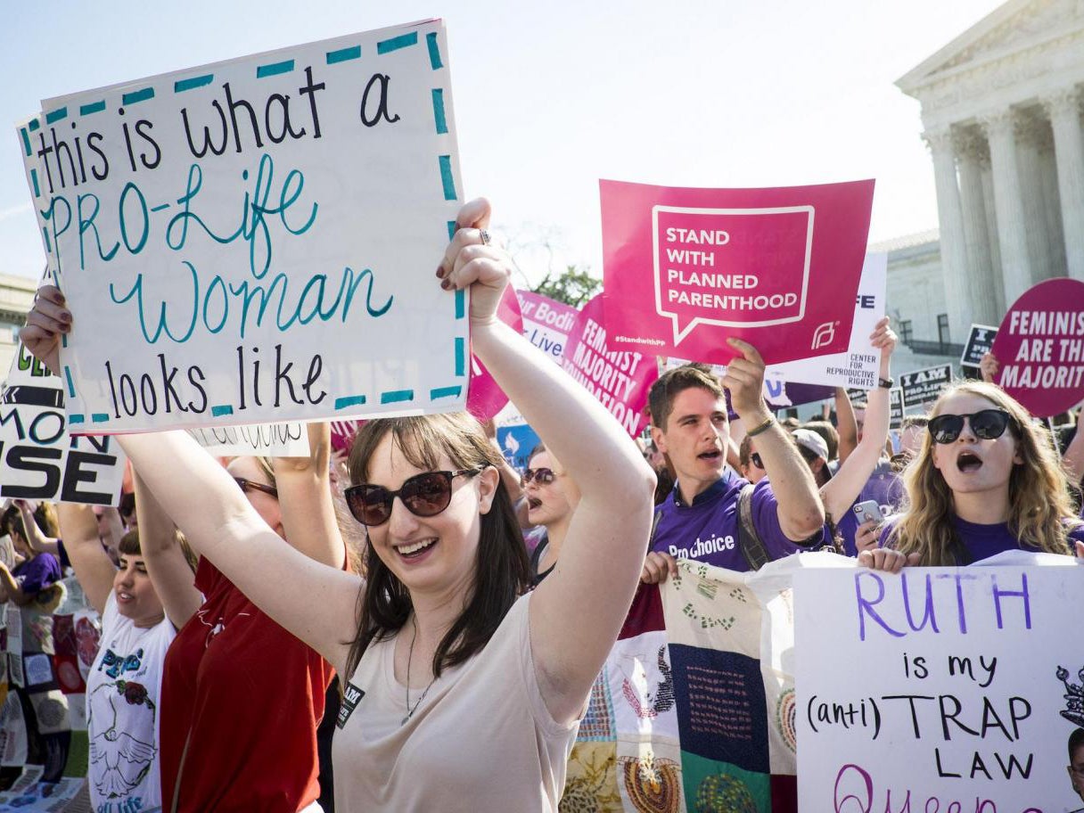 Pro-choice and anti-abortion activists demonstrate on the steps of the US Supreme Court