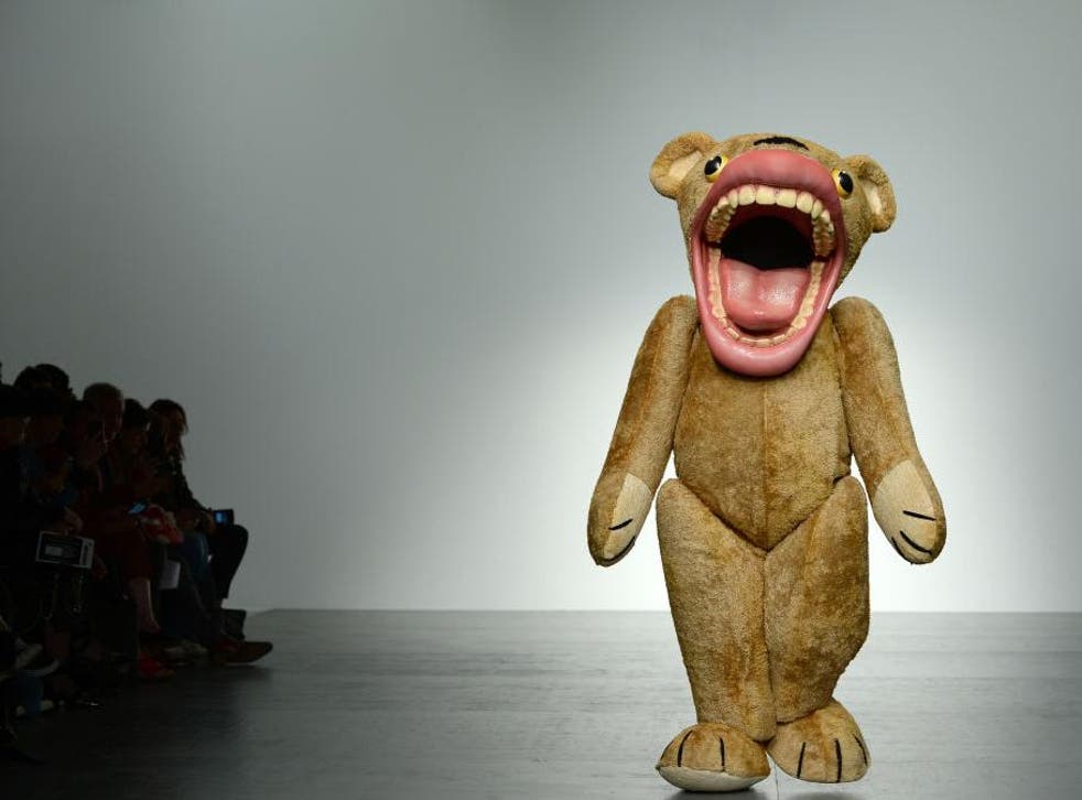 A model in a bear costume walks the runway at the Liam Hodges show 