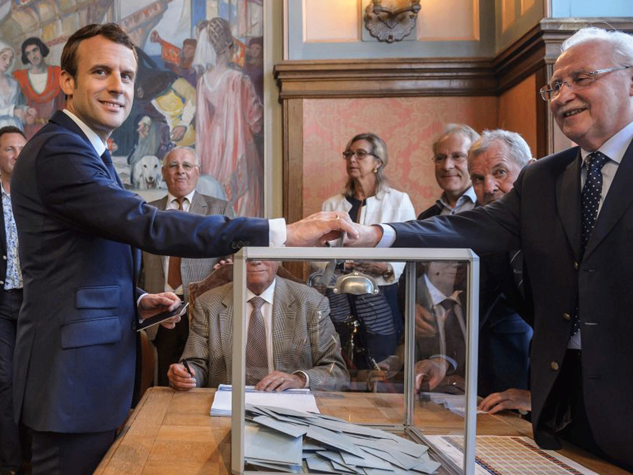 French President Emmanuel Macron casts his vote on Sunday