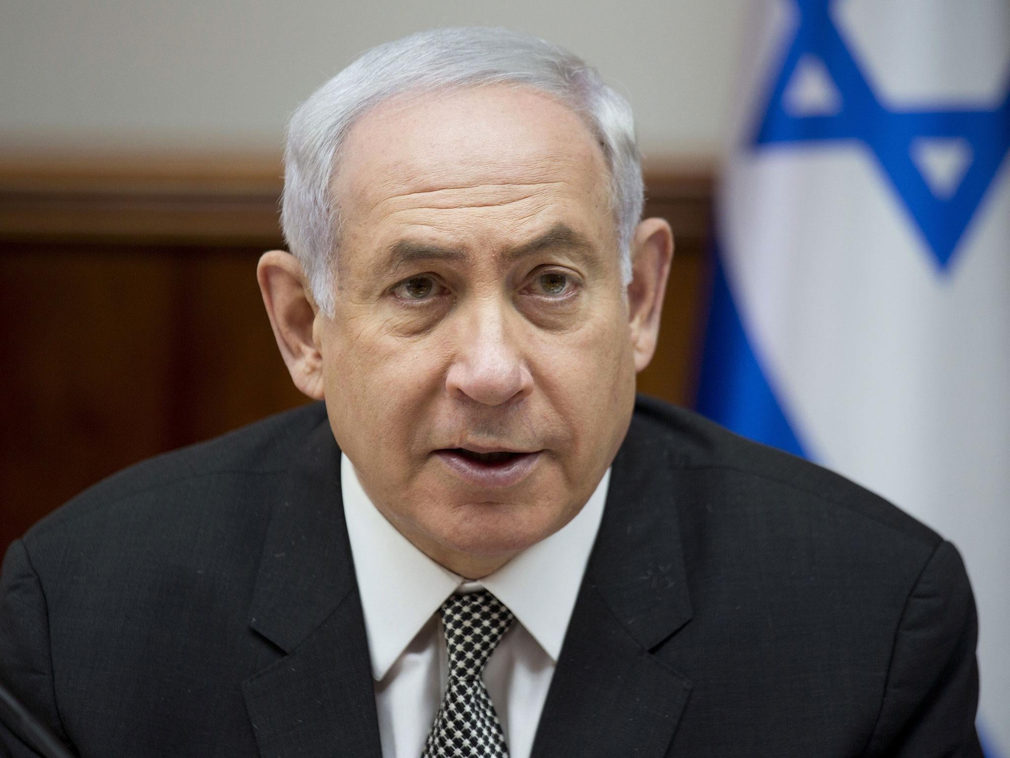 Israeli Prime Minister Benjamin Netanyahu chairs a weekly cabinet meeting at his office in Jerusalem