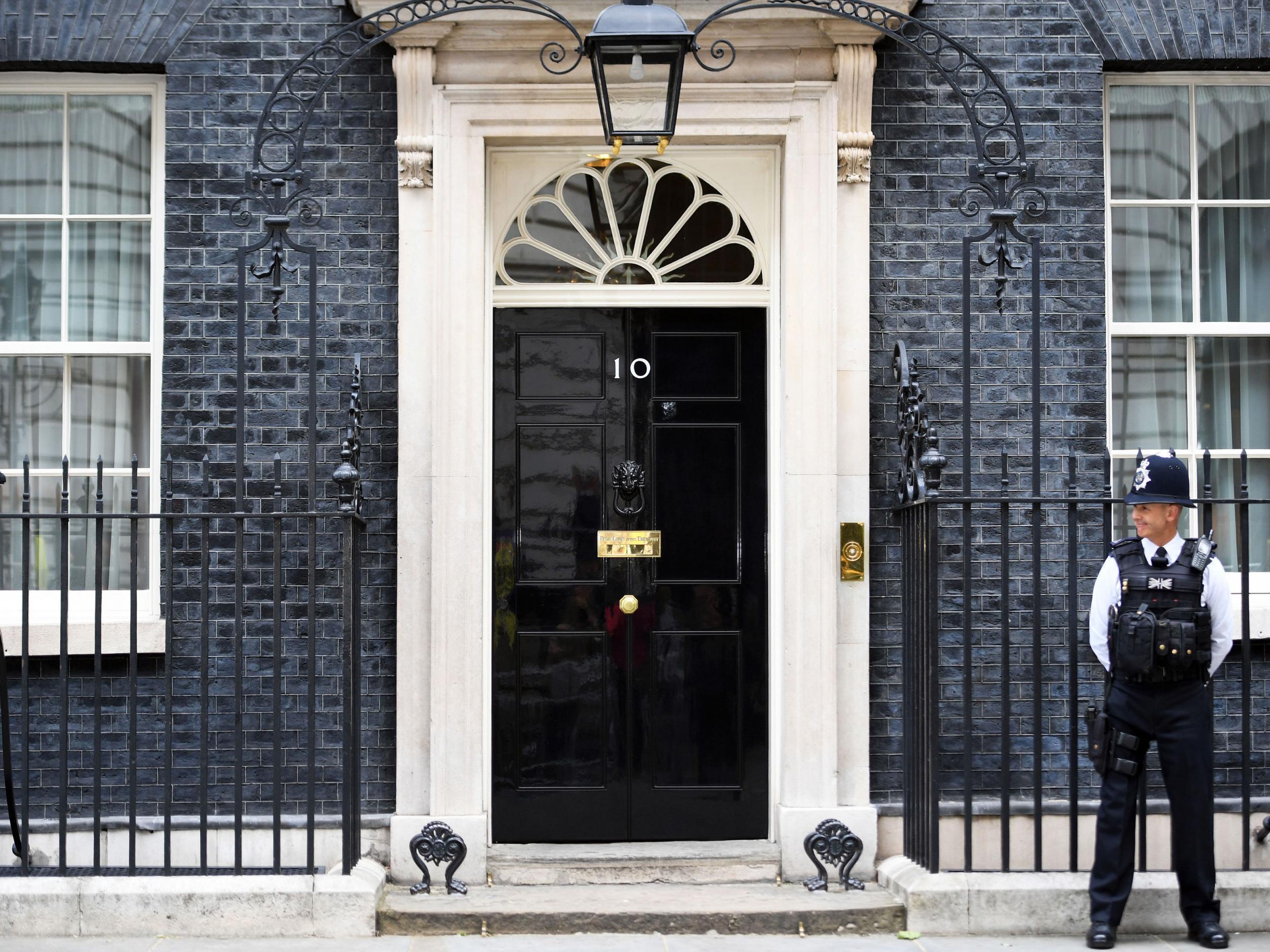 Downing Street is heavily guarded with gates that shut off the road