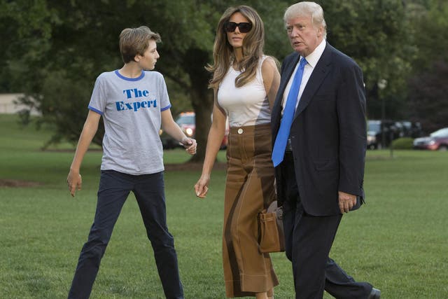 President Donald Trump, first lady Melania and their son Barron arrive at the White House