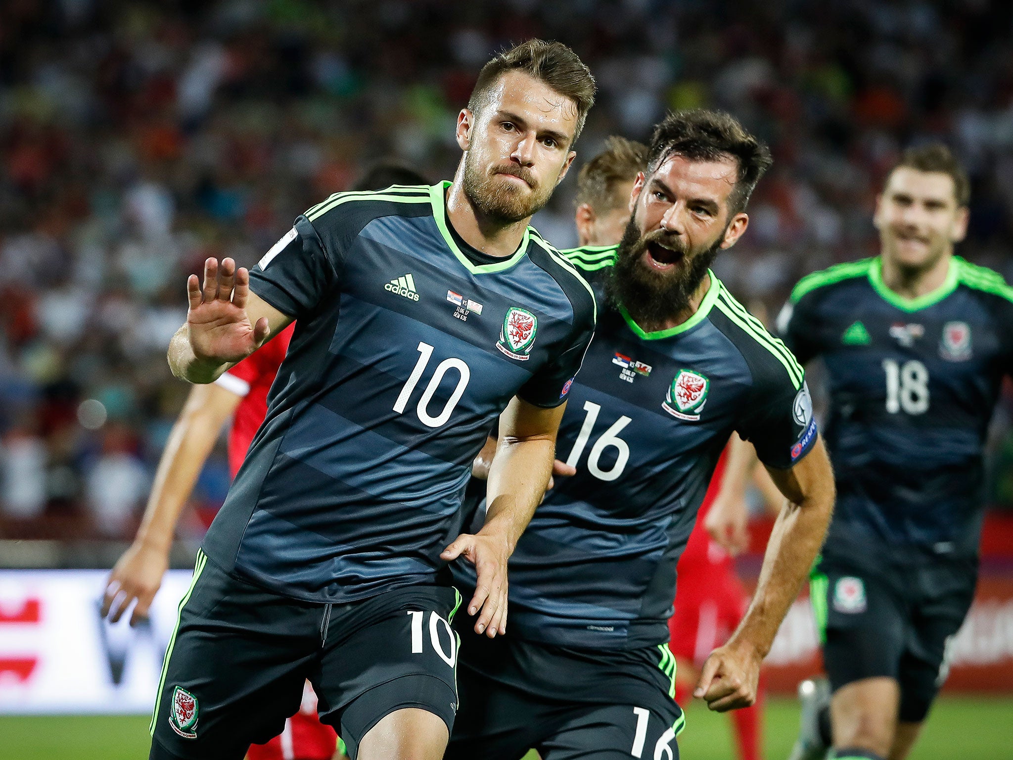 Ramsey celebrates after scoring from the spot