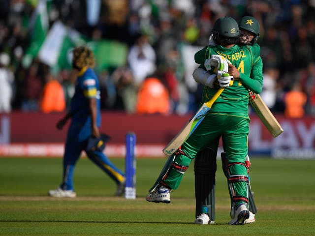 Sarfraz Ahmed and Mohammad Amir celebrate after securing victory
