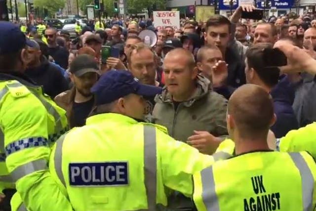 Far-right protesters clashed with police and counter-demonstrators in Manchester on Sunday