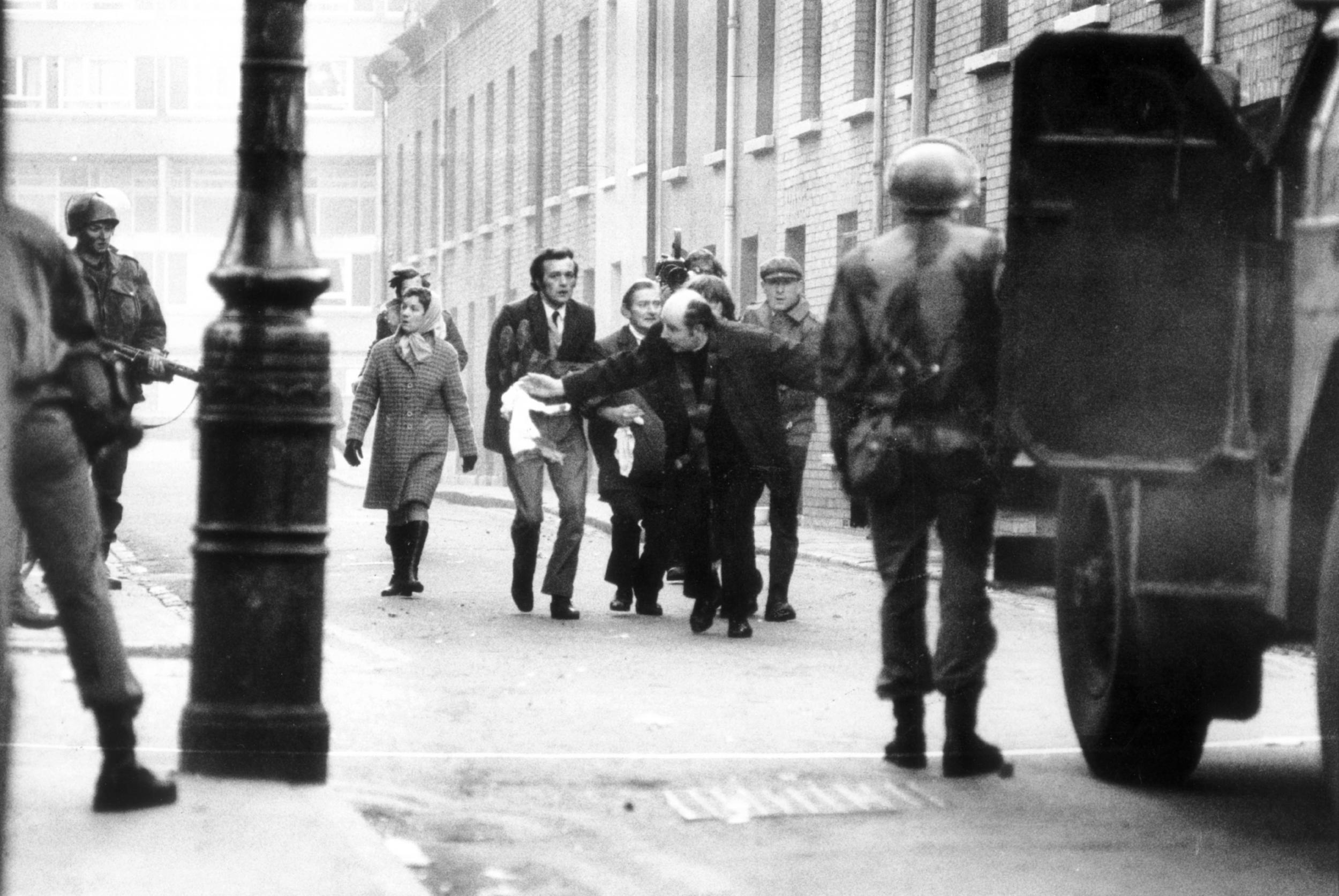 Father Edward Daly (who became Bishop of Derry) leads casualties to safety on Bloody Sunday