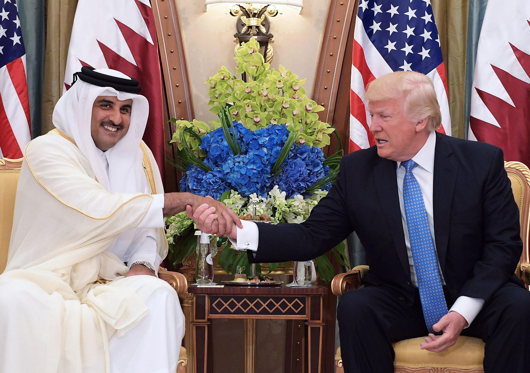 Crunchtime: Mr Trump with Qatar’s emir Tamim bin Hamad Al-Thani in Riyadh in May