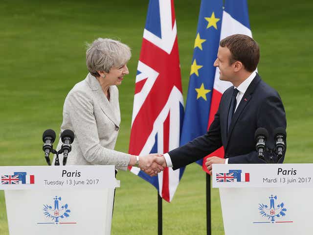 French President Emmanuel Macron and Prime Minister Theresa May shake hands after holding a joint press conference at the Elysee Palace during her visit to Paris, France