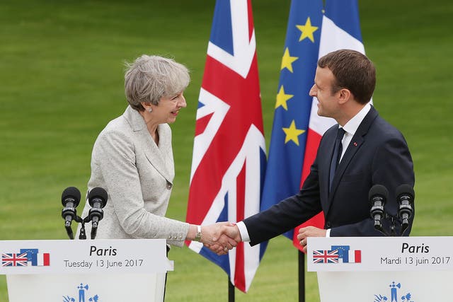 French President Emmanuel Macron and Prime Minister Theresa May shake hands after holding a joint press conference at the Elysee Palace during her visit to Paris, France