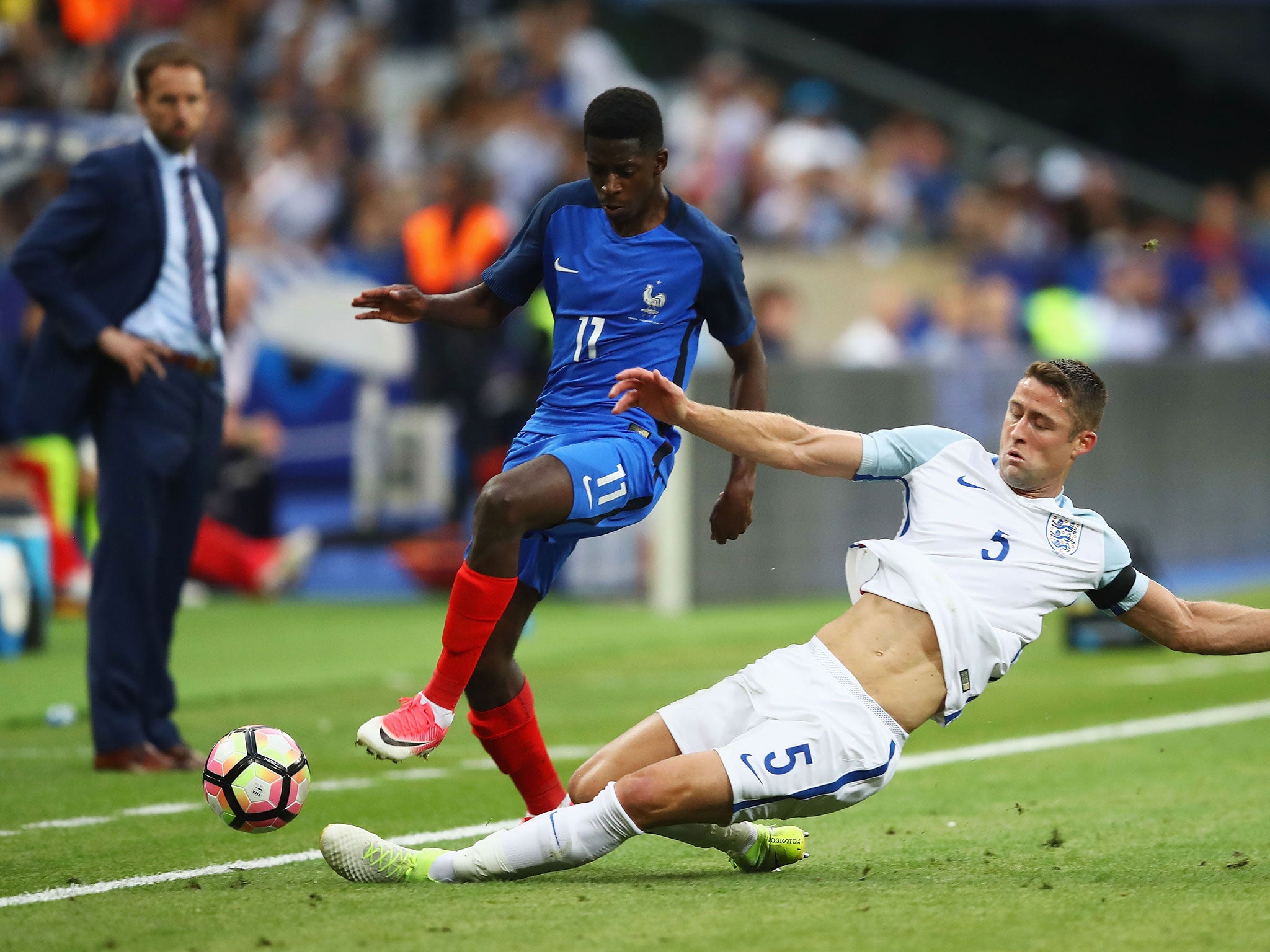 &#13;
Cahill puts a tackle in on Dembele &#13;