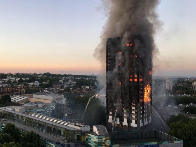 Flames and smoke rising from the 27-storey block of flats in west London