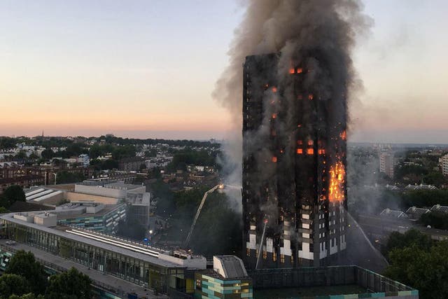 Flames and smoke rising from the 27-storey block of flats in west London