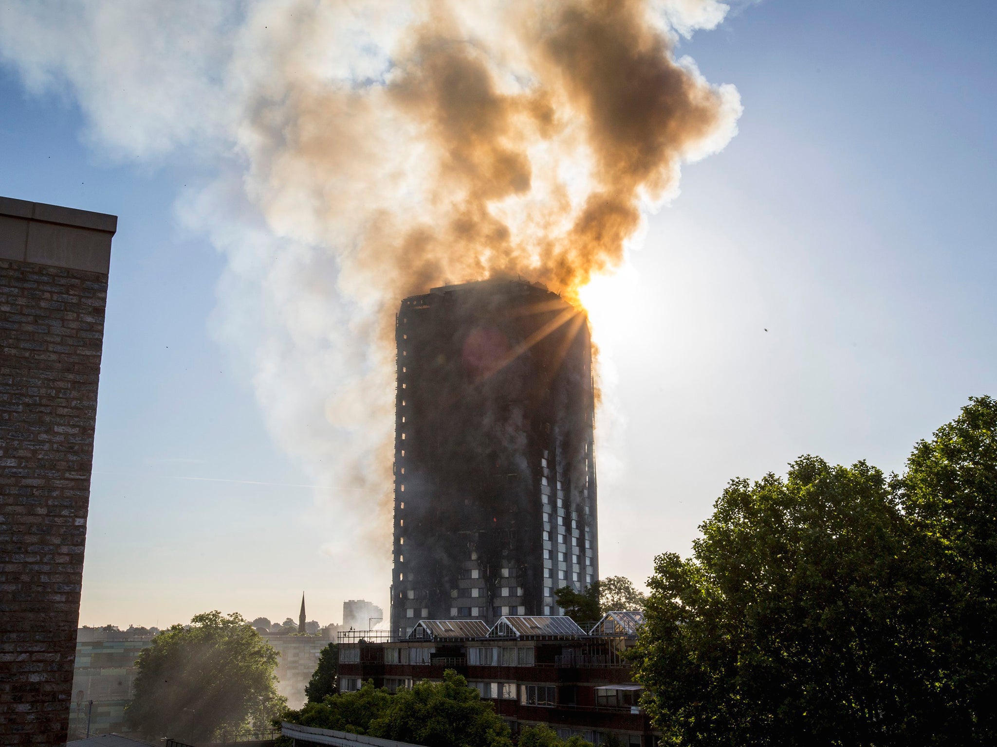 Smoke billows from a fire that has engulfed the 27-storey Grenfell Tower in west London