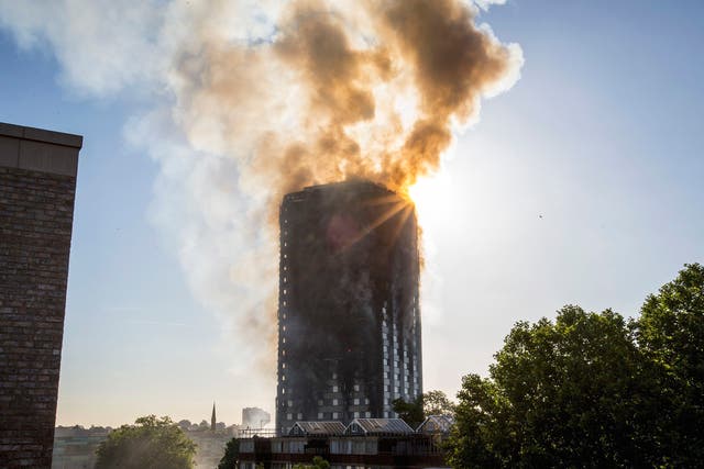 Smoke billows from a fire that has engulfed the 27-storey Grenfell Tower in west London