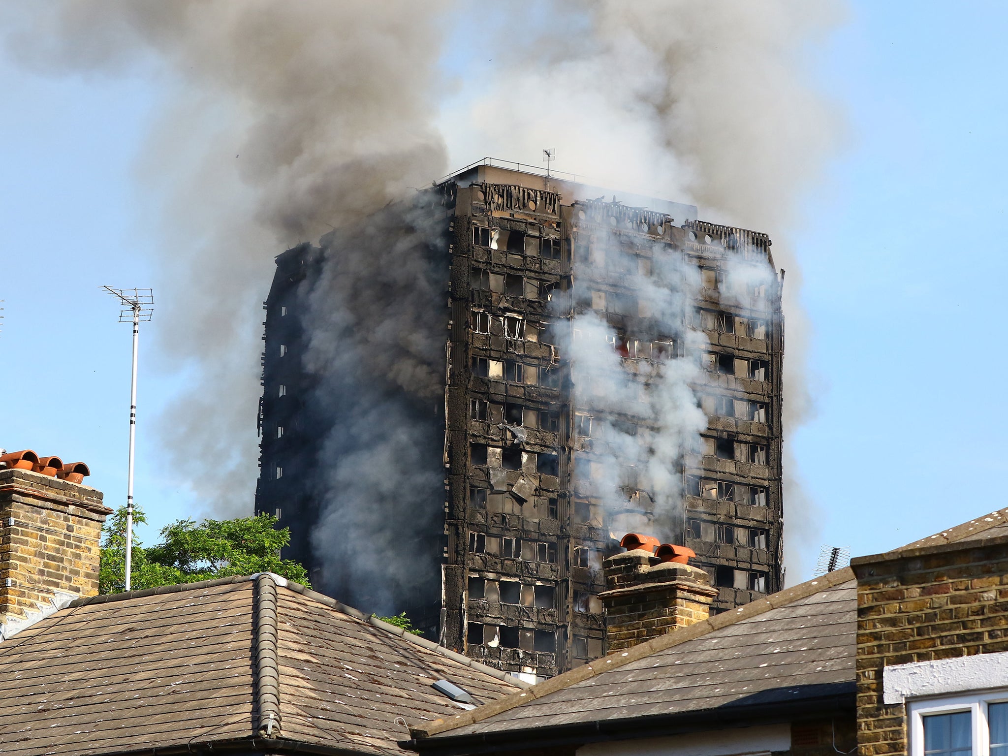 Smoke billows from a fire that has engulfed the 24-storey Grenfell Tower in west London