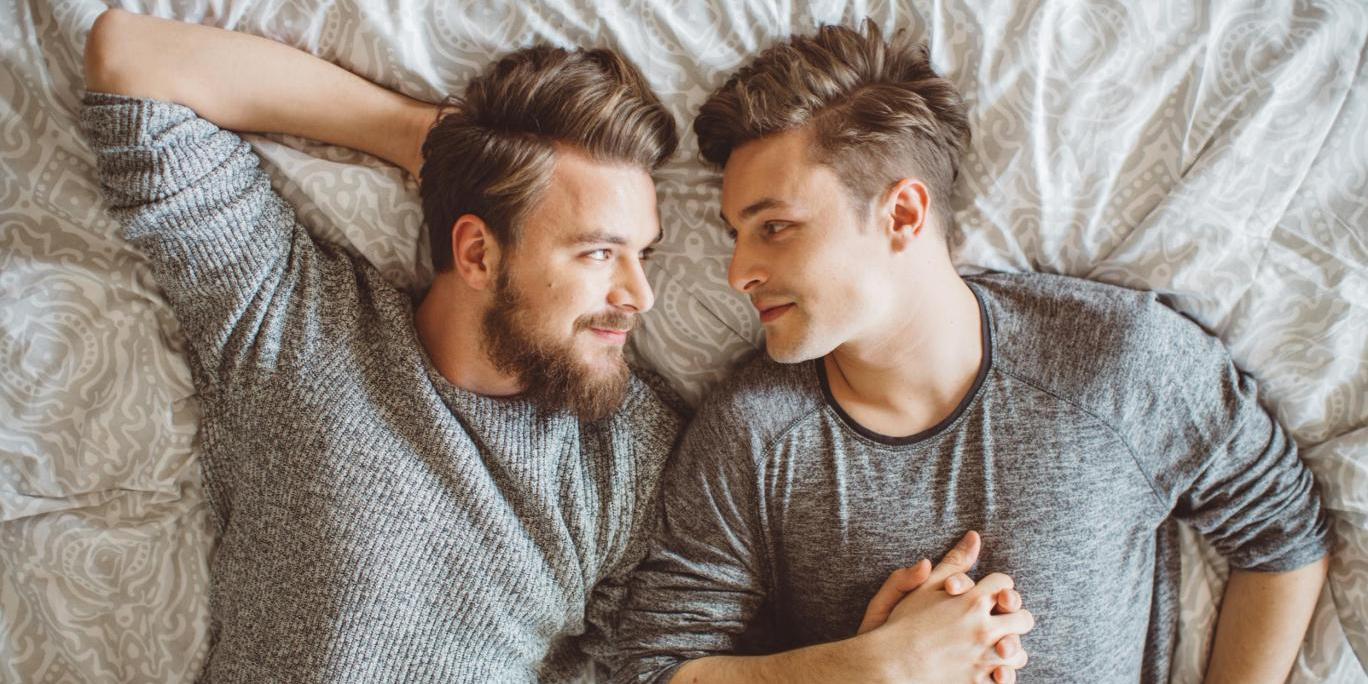 Latino gay men making love