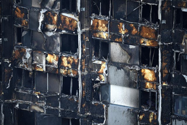 The fire-damaged lower floors of the 24-storey residential Grenfell Tower block