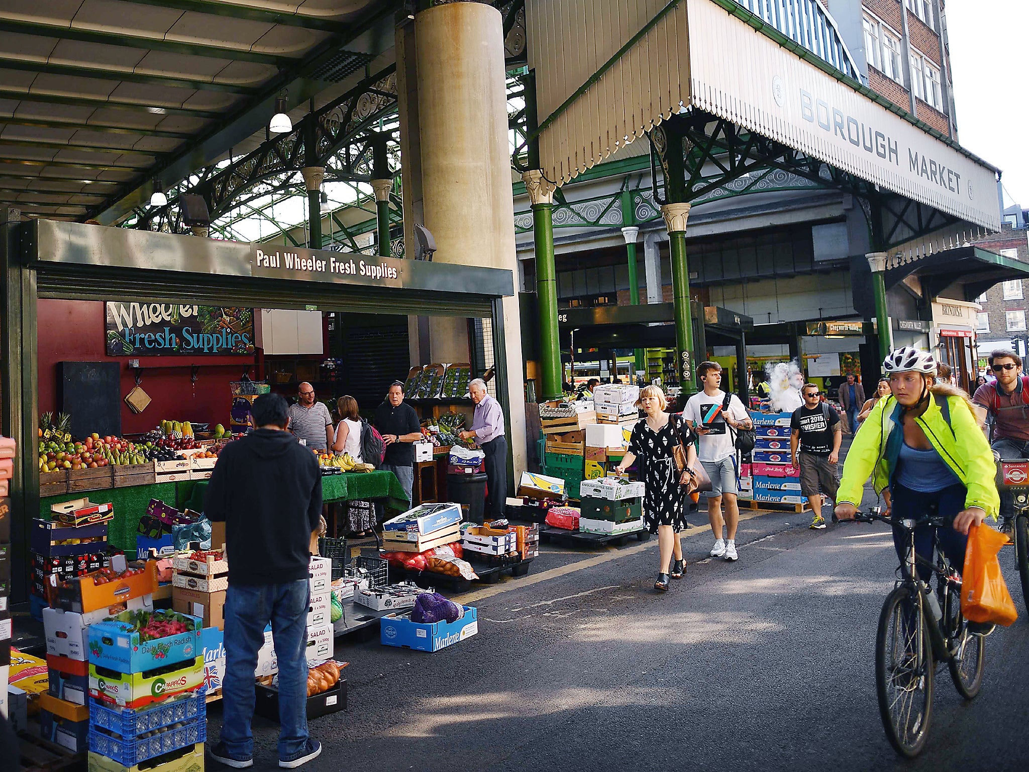 People walk through Borough Market in central London following its re-opening after the June 3 terror attack (Getty)