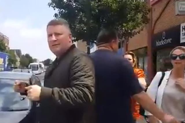 Footage shows Britain First leader, Paul Golding, standing outside the East London Mosque
