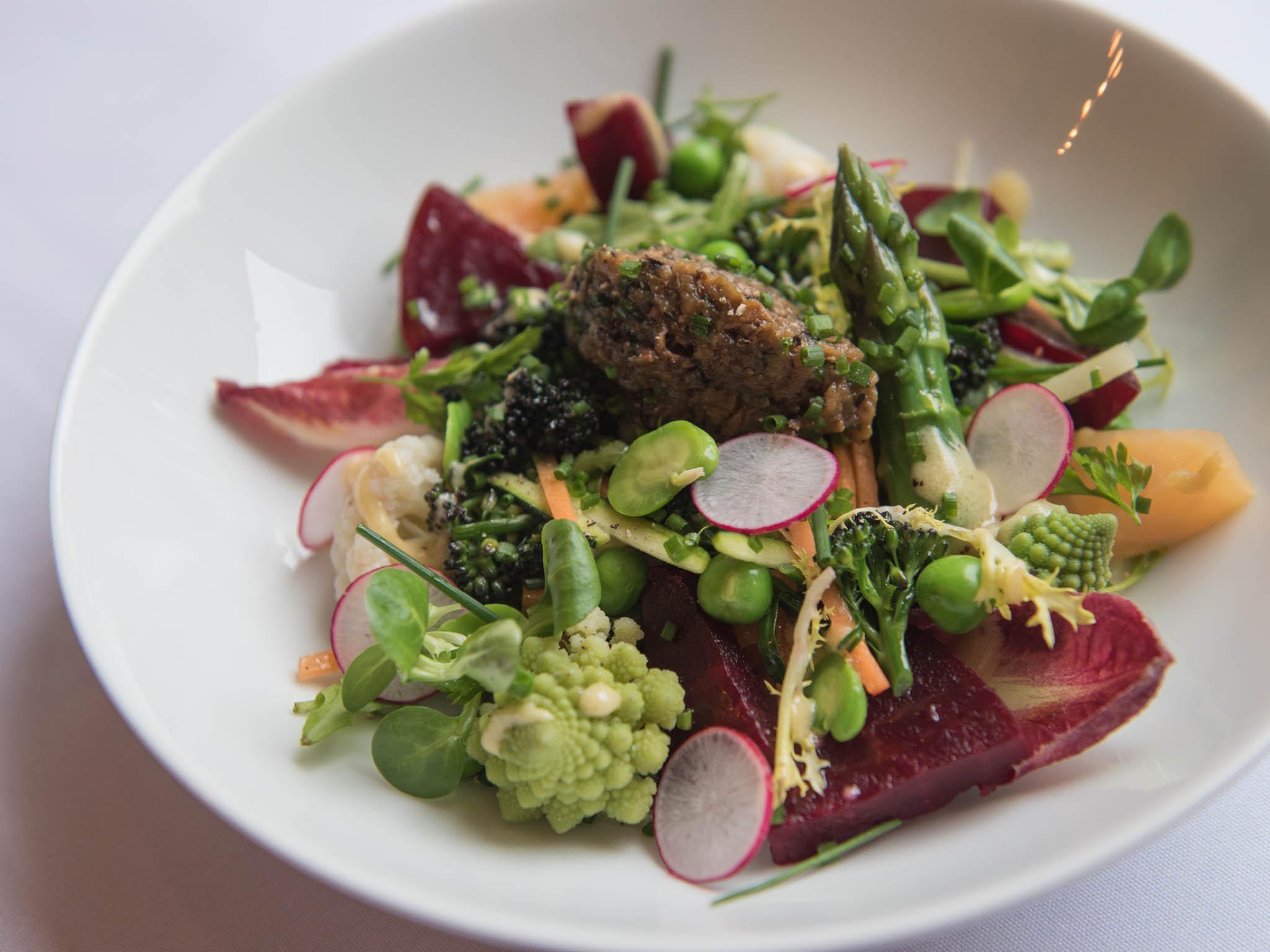 Spring garden vegetables salad with aubergine and pickled walnut