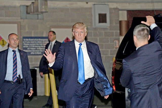 US President Donald Trump (C) and leaves the MedStar Washington Hospital Center after visiting victims of the shooting at a baseball practice session