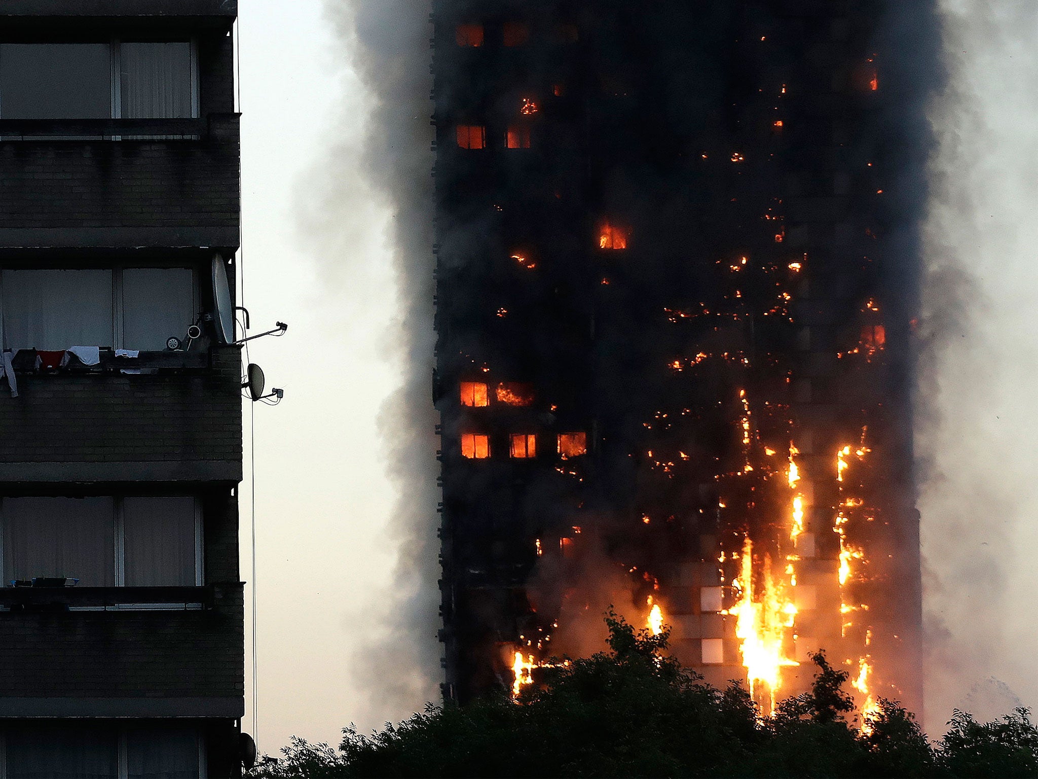 Smoke and flames rise from Grenfell Tower in west London