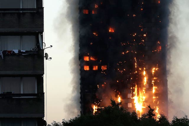 Smoke and flames rise from Grenfell Tower in west London