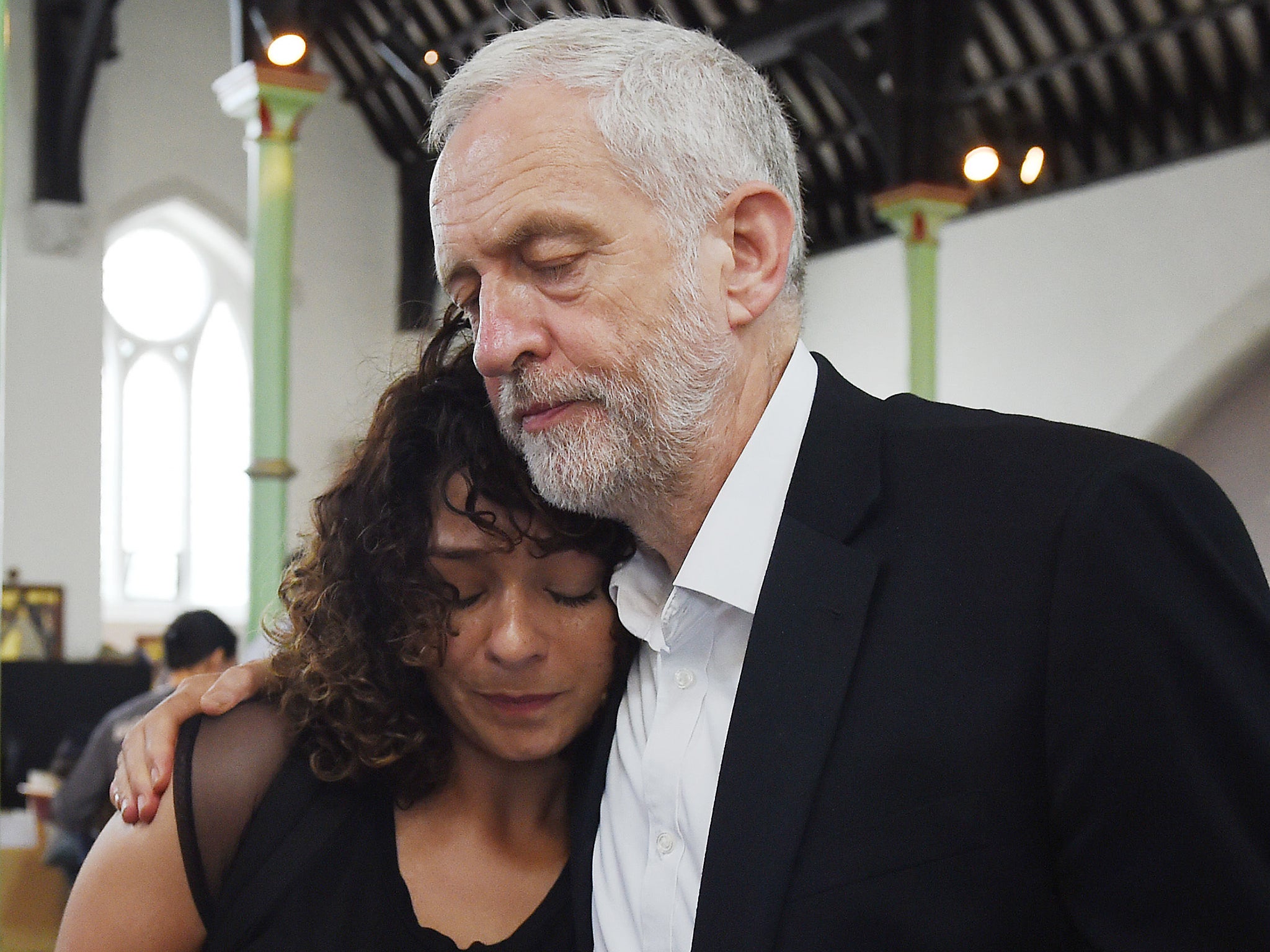 Labour leader Jeremy Corbyn comforts a local resident (name not given) at St Clement's Church in west London where volunteers have provided shelter and support for people affected by the fire at Grenfell Tower (David Mirzoeff/PA Wire)