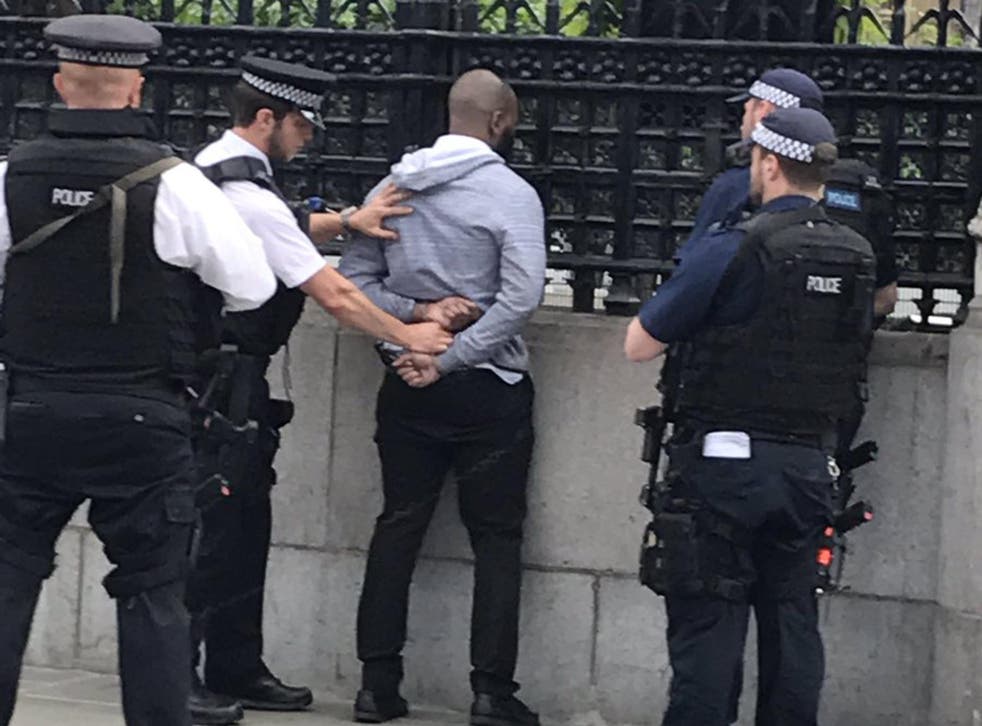 A man being arrested outside Parliament