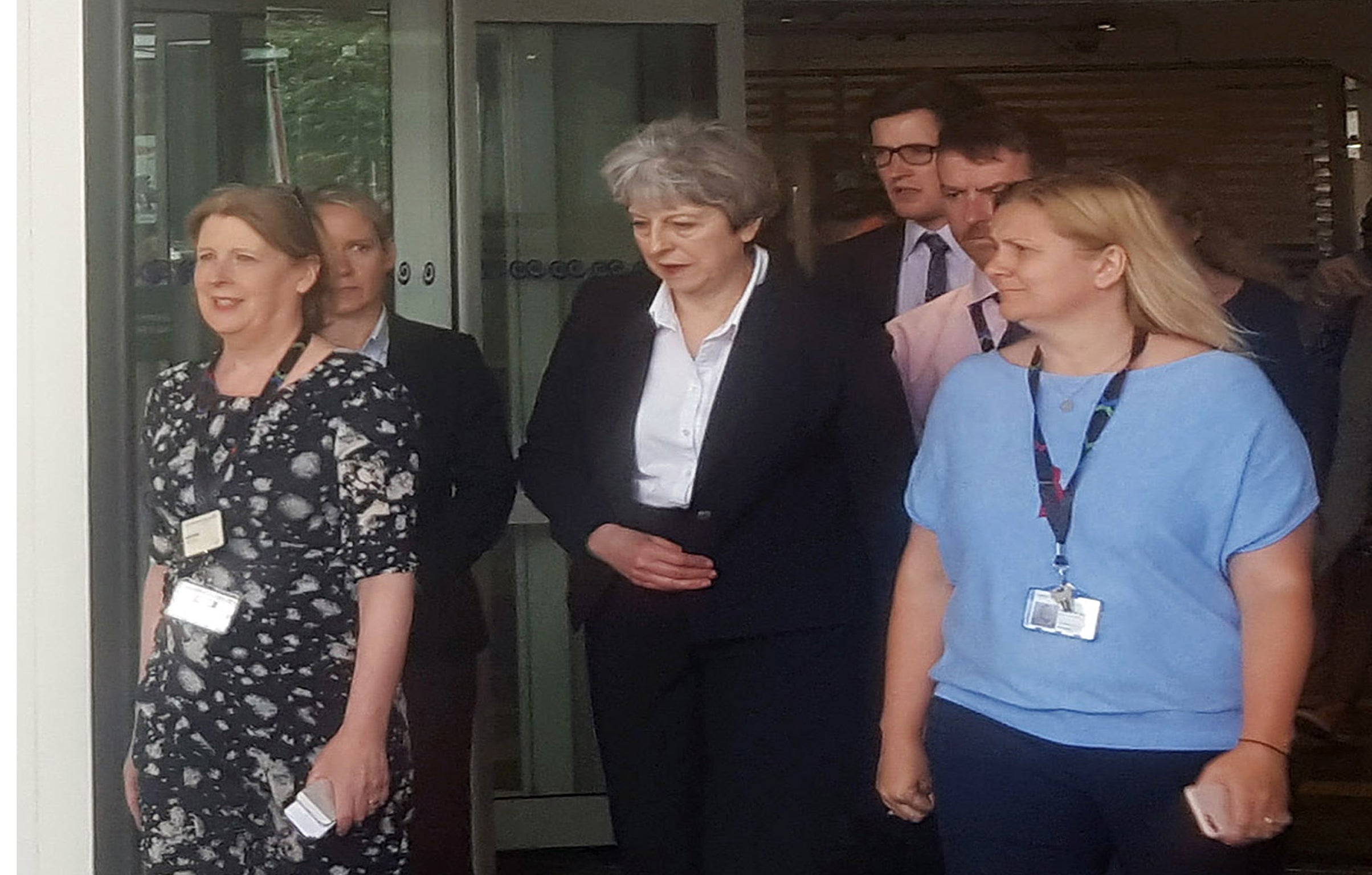Theresa May leaves the Chelsea and Westminster Hospital in London after visiting people who were injured in the Grenfell Tower fire
