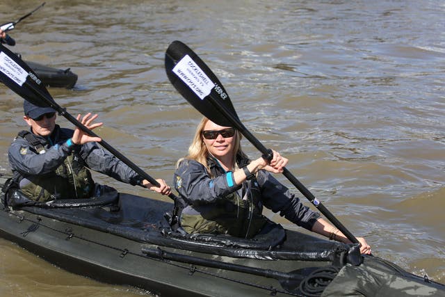Jodie Kidd and members of the special boat service association recreate a training paddle in military canoes on the Thames