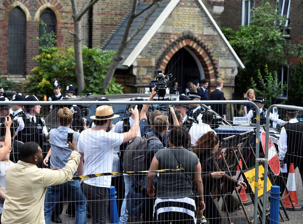 Theresa May announced the measures while visiting fire survivors at a church in Kensington