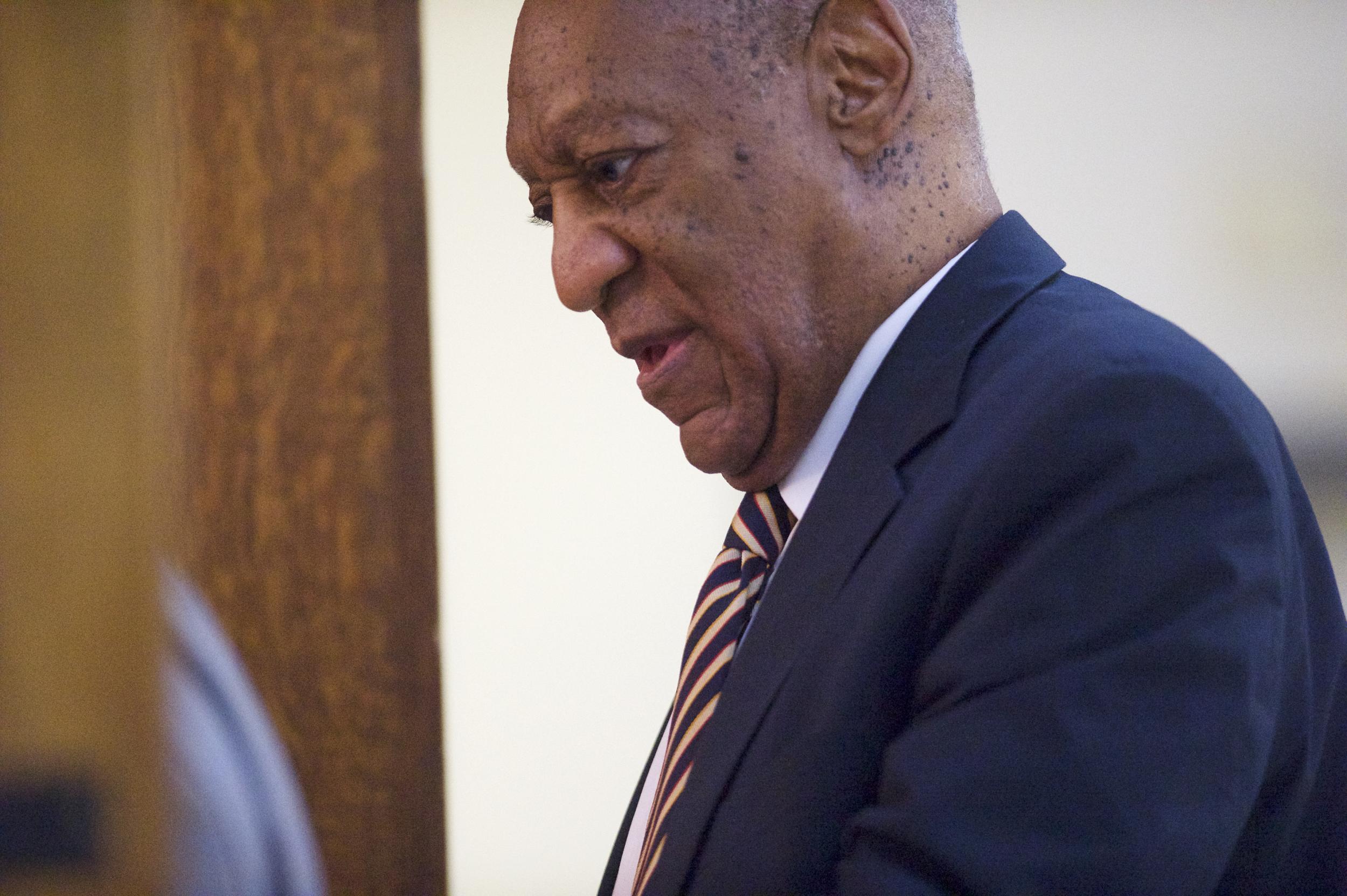 Bill Cosby enters the courtroom on the third day of jury deliberations in his sexual assault trial at the Montgomery County Courthouse