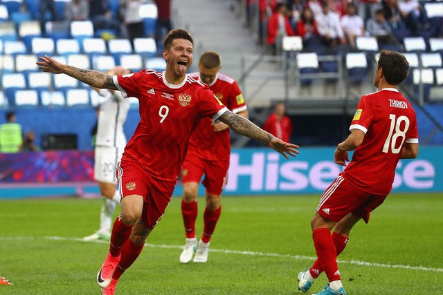 Fedor Smolov celebrates scoring Russia's second goal